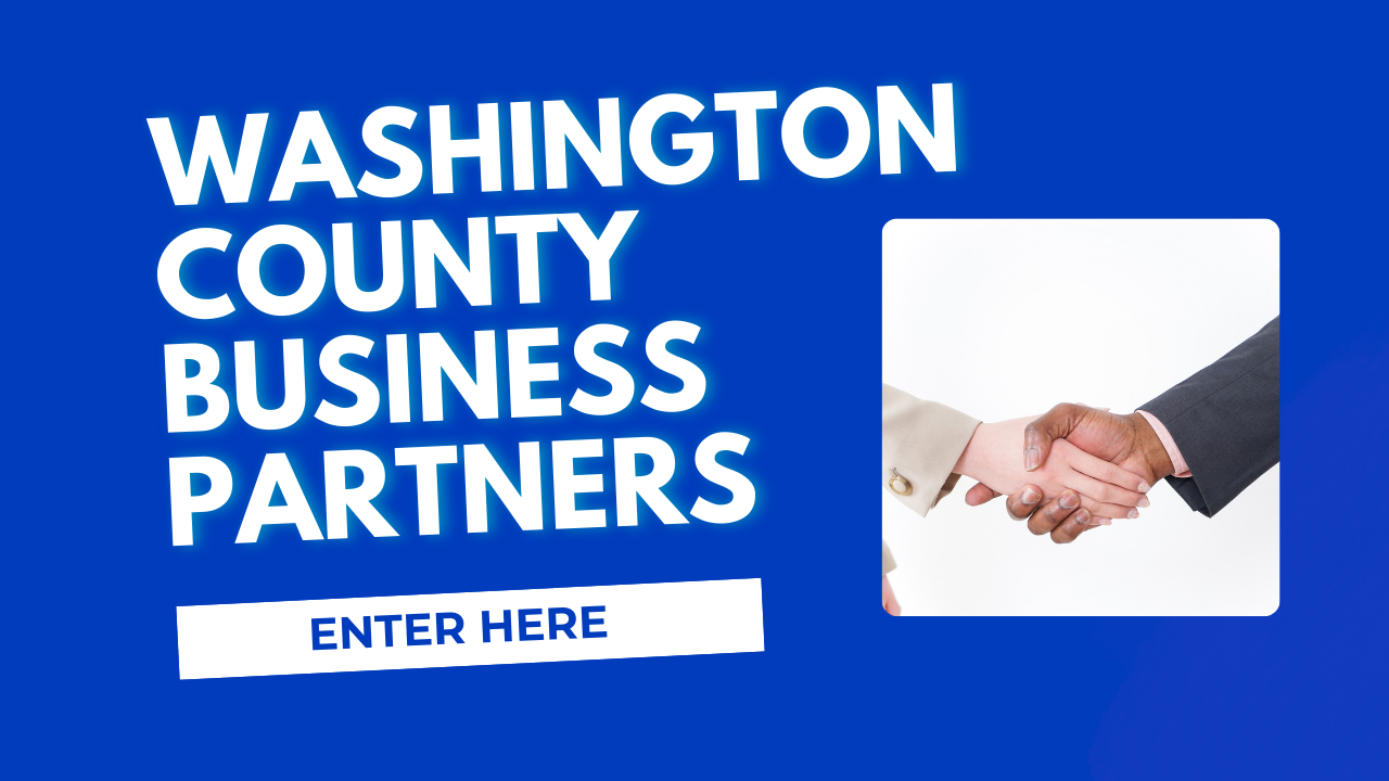 Blue background with two hands shaking and the words Washington County Business Partners Enter Here on the left of the picture of hands.